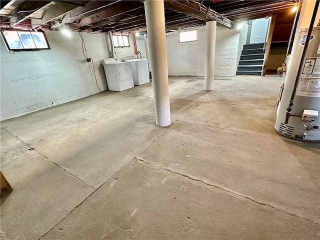 basement with washer and clothes dryer and gas water heater