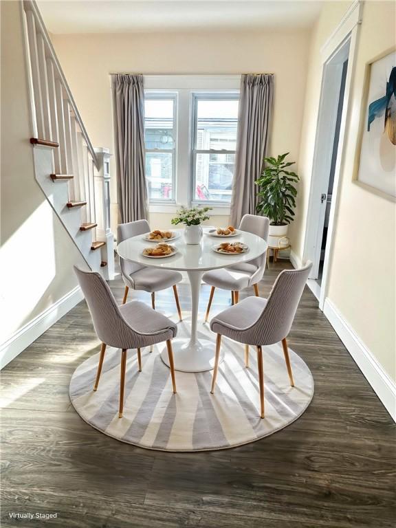 dining space featuring dark hardwood / wood-style floors