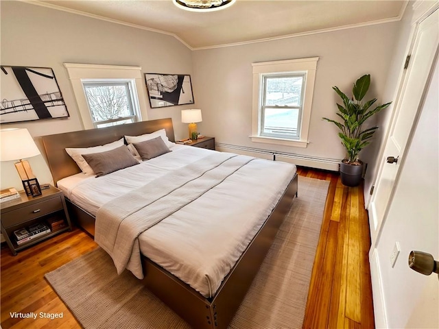 bedroom with vaulted ceiling, multiple windows, dark hardwood / wood-style floors, and ornamental molding