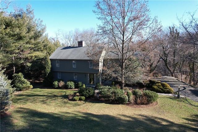 view of home's exterior featuring a lawn