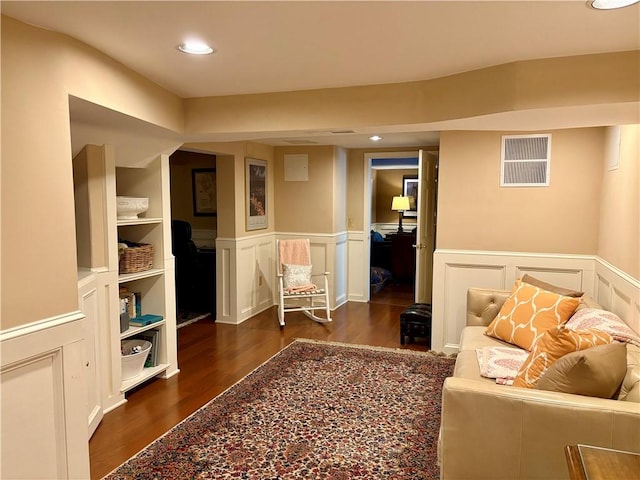 sitting room featuring dark hardwood / wood-style flooring