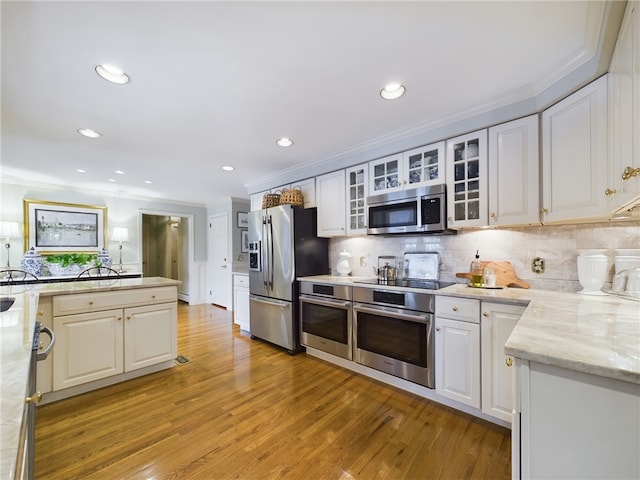 kitchen featuring appliances with stainless steel finishes and white cabinetry