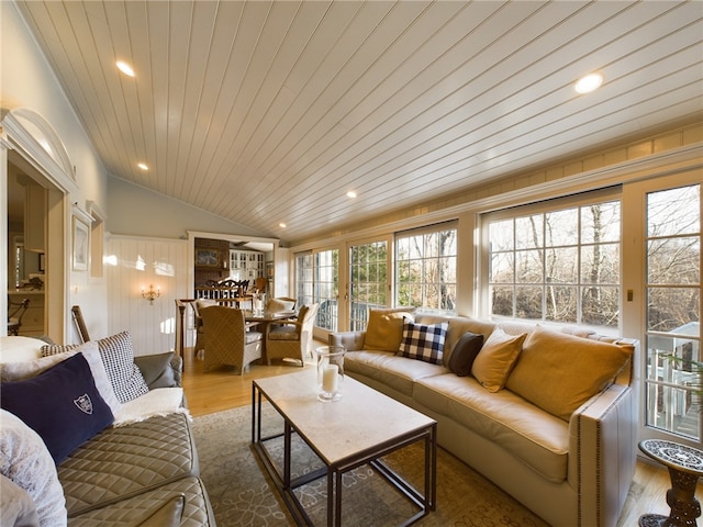 living room with hardwood / wood-style floors, lofted ceiling, and wood ceiling