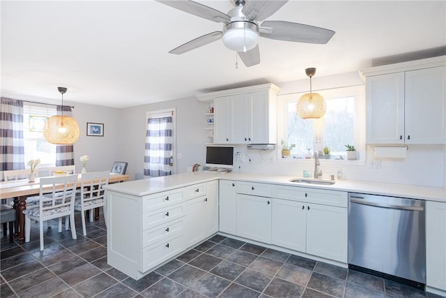 kitchen featuring dishwasher, white cabinetry, sink, and kitchen peninsula