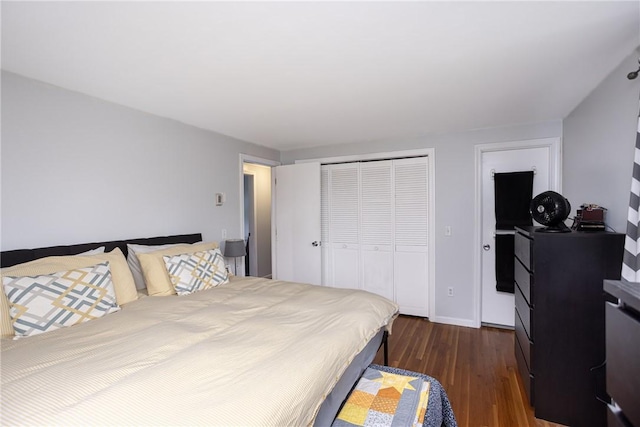 bedroom featuring dark hardwood / wood-style flooring and a closet