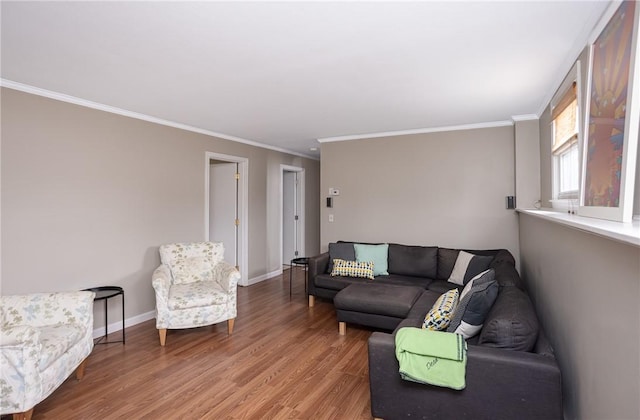 living room featuring crown molding and wood-type flooring