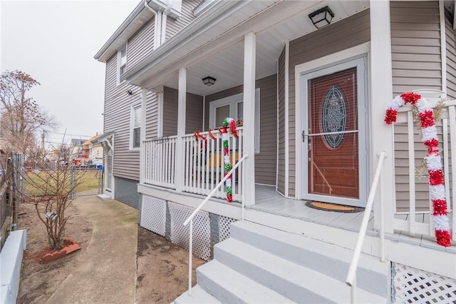 doorway to property featuring a porch