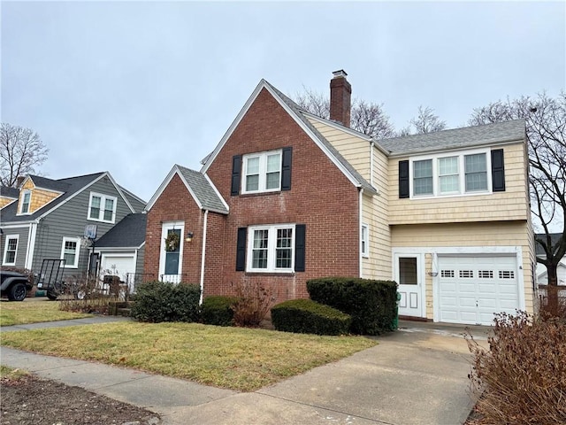 view of front of house featuring a garage and a front yard