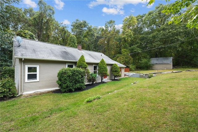 exterior space with a yard and a shed