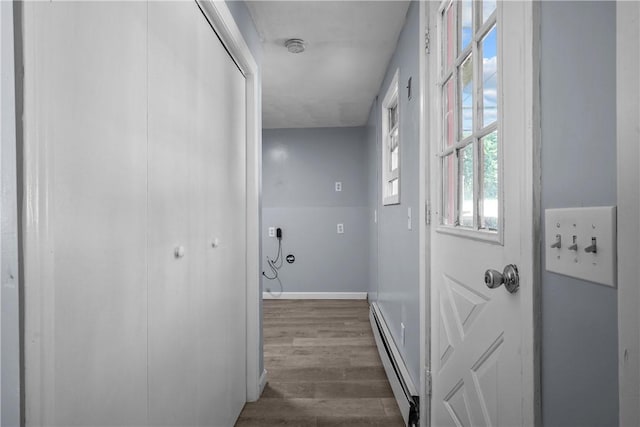 hall featuring dark hardwood / wood-style flooring and a baseboard radiator