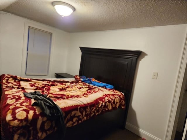 bedroom featuring a textured ceiling