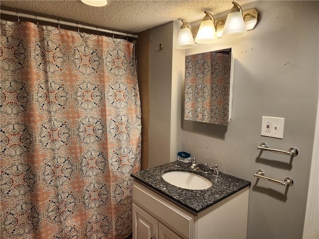 bathroom featuring vanity and a textured ceiling