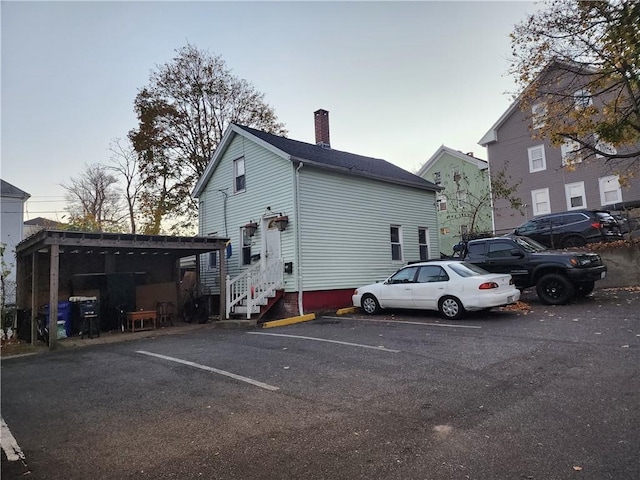 exterior space featuring a carport