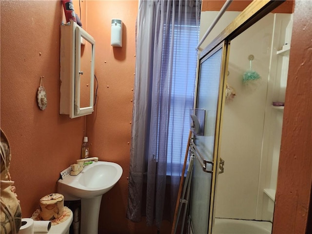 bathroom with shower / bathing tub combination and sink