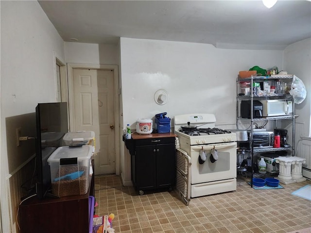 kitchen with white range with gas cooktop