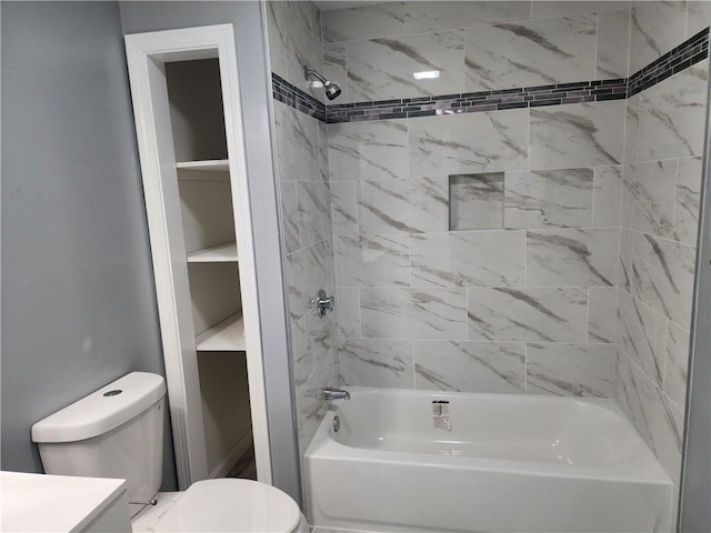 full bathroom with vanity, toilet, and tiled shower / bath