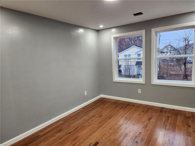 empty room featuring hardwood / wood-style floors