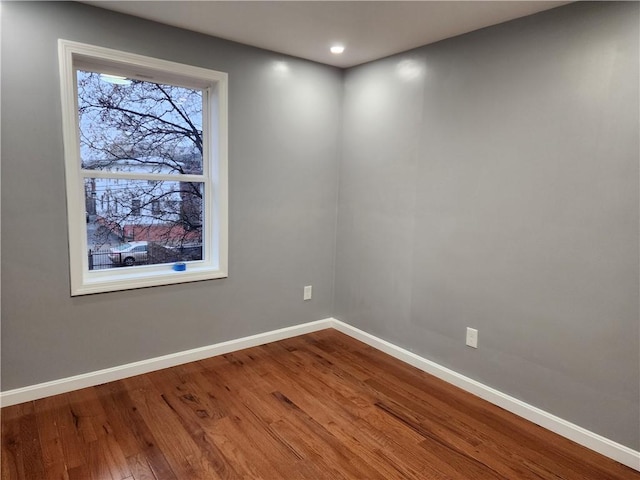 unfurnished room featuring hardwood / wood-style floors