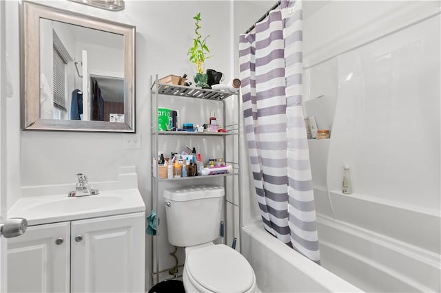 full bathroom featuring shower / bath combination with curtain, vanity, and toilet