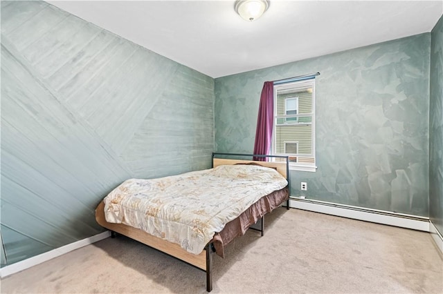 carpeted bedroom with a baseboard heating unit