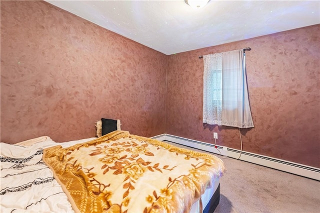 bedroom featuring carpet floors and baseboard heating