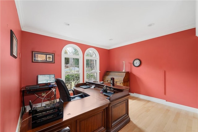 home office with crown molding and light wood-type flooring