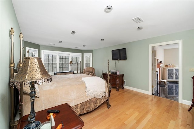 bedroom with hardwood / wood-style flooring