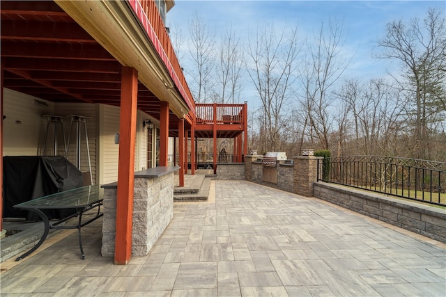 view of patio with exterior kitchen and grilling area