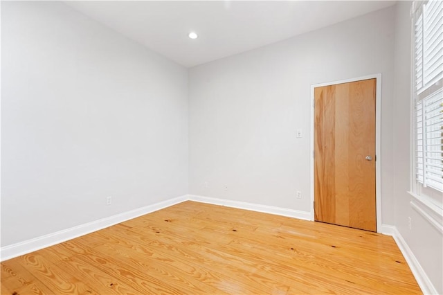 spare room featuring hardwood / wood-style floors