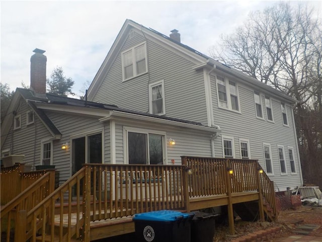 rear view of property with a deck