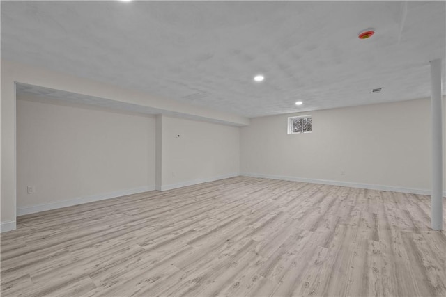 basement featuring light wood-type flooring