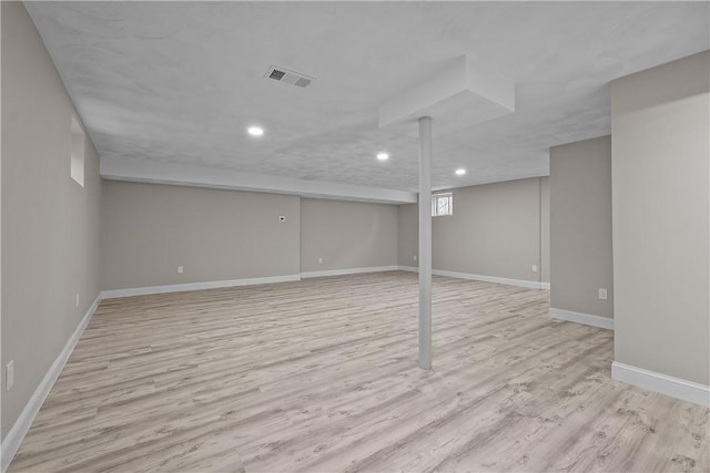 basement featuring light wood-type flooring