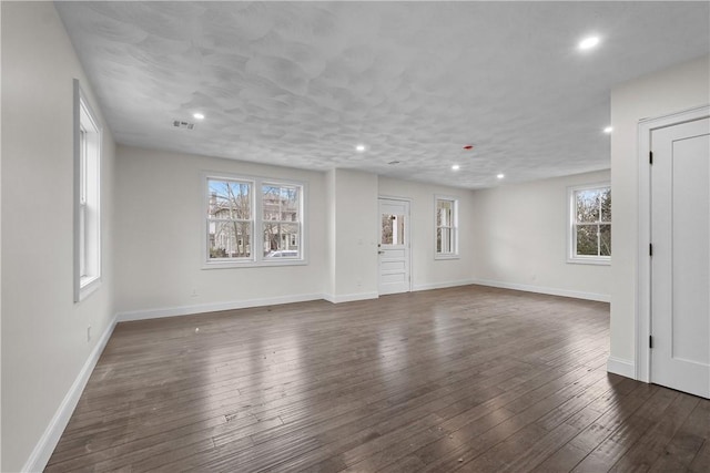 spare room featuring dark hardwood / wood-style flooring