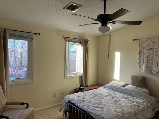 bedroom with light colored carpet and ceiling fan