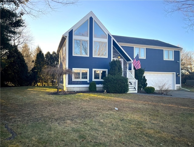 view of front of property with a garage and a front lawn