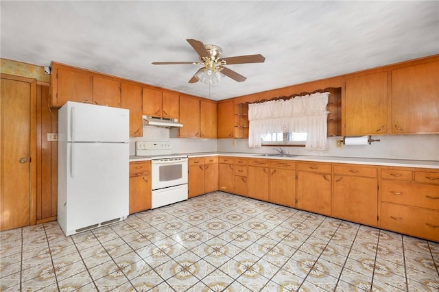 kitchen with ceiling fan, white appliances, and sink