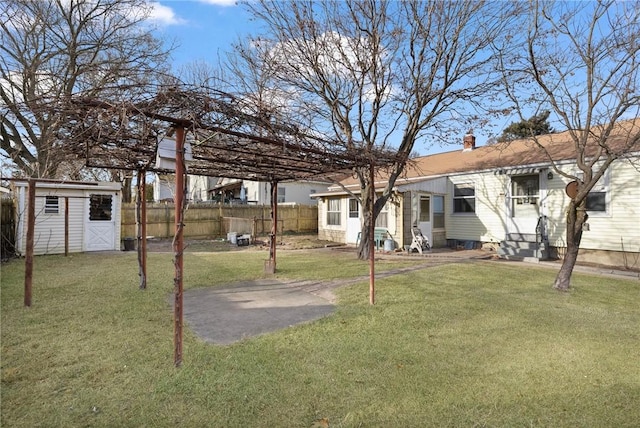 view of yard with a storage unit