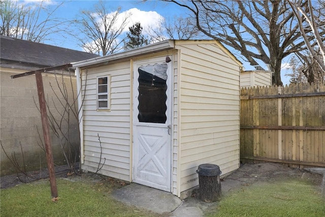 view of outbuilding with a yard