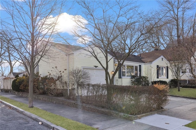 view of side of home featuring a garage