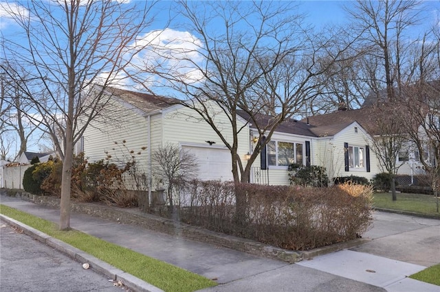 view of property exterior featuring a garage