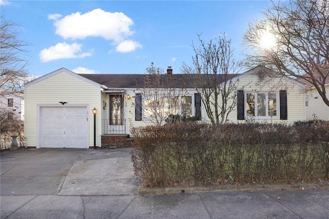 ranch-style house featuring a garage