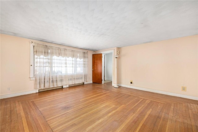 unfurnished room featuring wood-type flooring