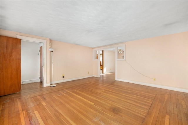 unfurnished room featuring light hardwood / wood-style flooring