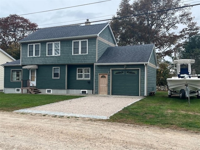 view of front property featuring a front yard and a garage