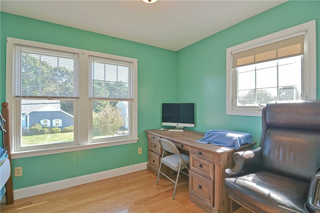 office area with light hardwood / wood-style floors