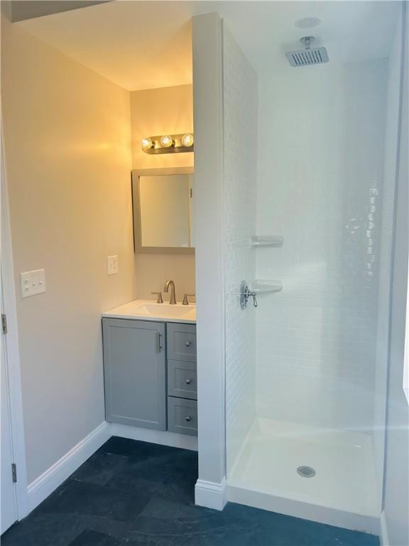 bathroom with a shower and vanity