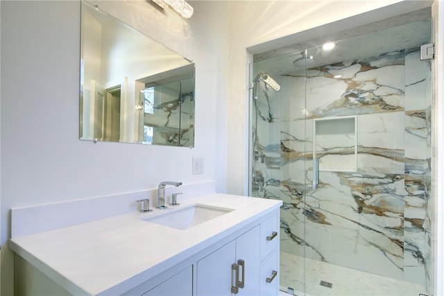 bathroom with an enclosed shower and vanity