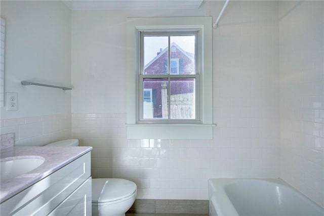 full bathroom featuring vanity, toilet, shower / bathtub combination, and tile walls