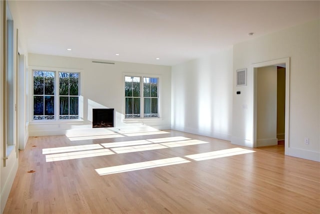 unfurnished living room with light wood-type flooring