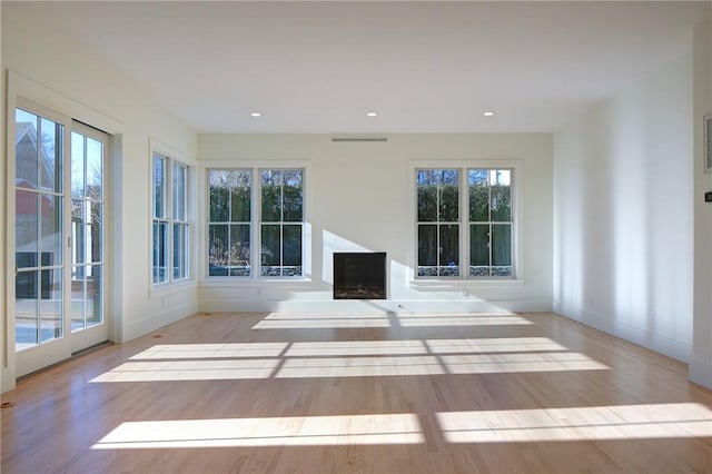 unfurnished living room featuring light hardwood / wood-style flooring